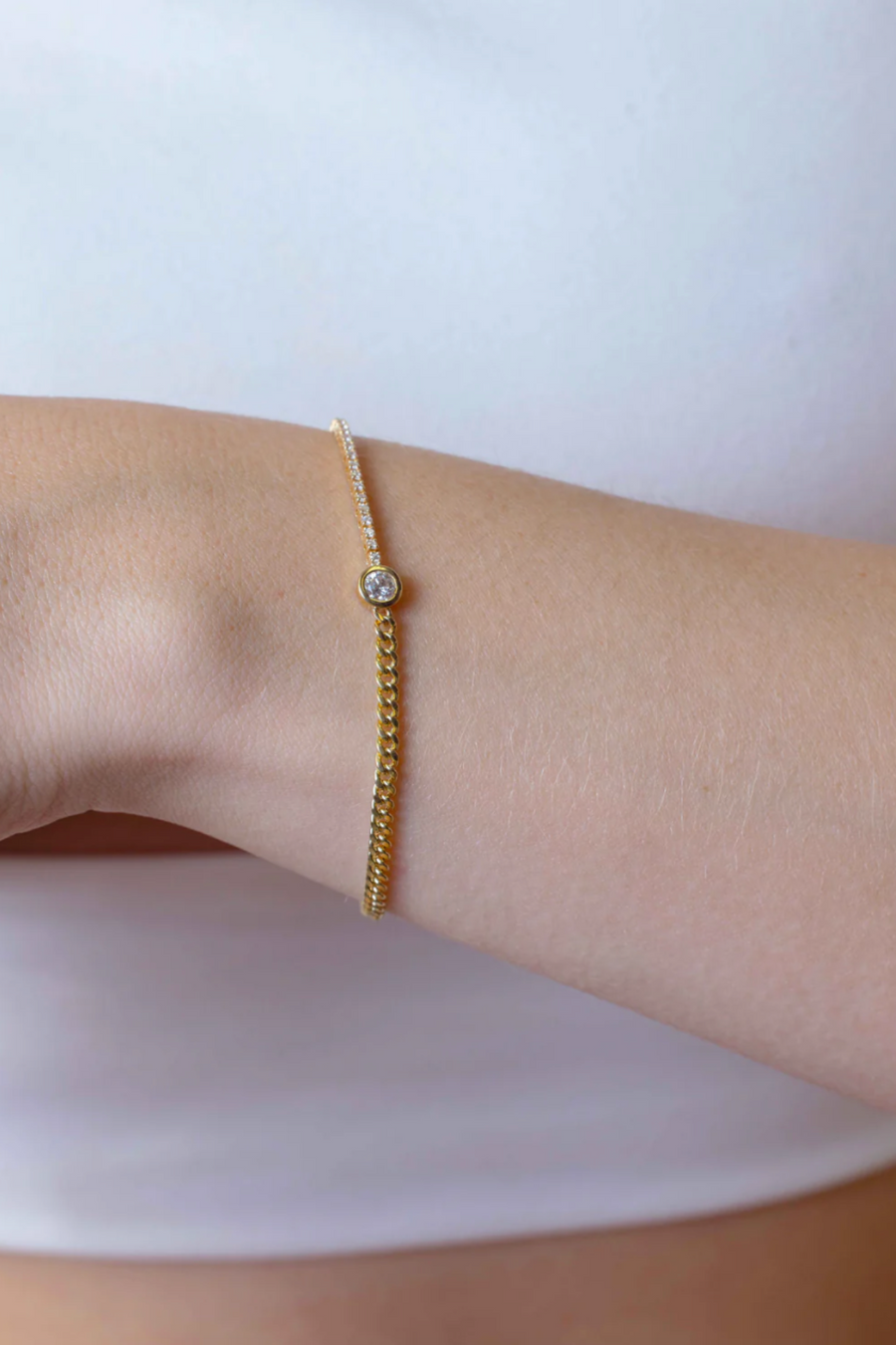 HALF TENNIS BRACELET WITH BEZEL SET CENTER DIAMOND